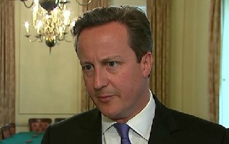 Beleaguered: A weary-looking David Cameron tried to defend his choice to employ convicted phone hacker Andy Coulson in a BBC interview.